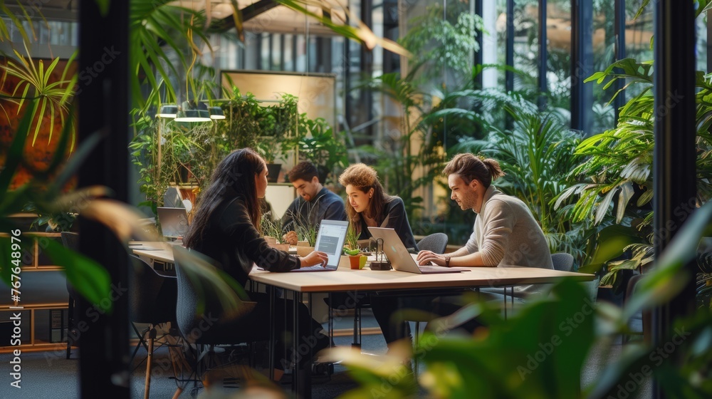 A modern co-working space bustling with professionals working on laptops surrounded by green indoor plants and natural light. AIG41