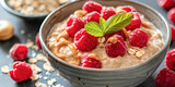 Oatmeal Porridge with Peanut Butter and Raspberries. A delectable bowl of oatmeal porridge topped with creamy peanut butter and fresh raspberries.