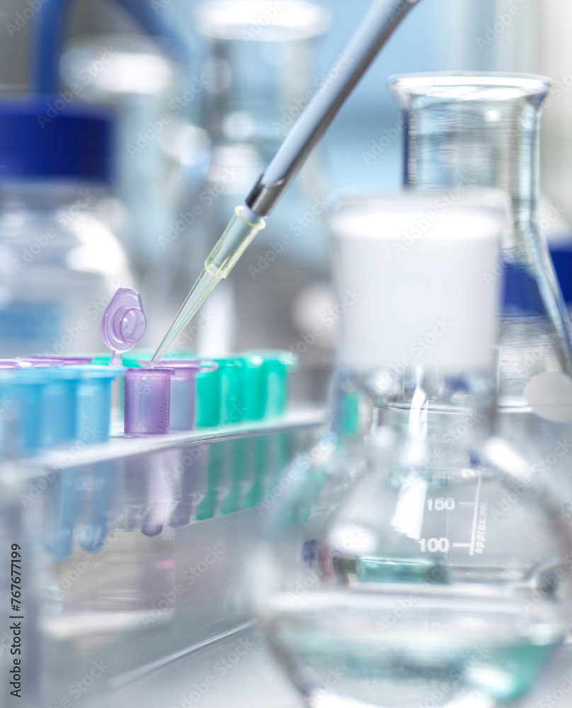 DNA Research, Scientist extracting a human sample for analysis DNA Research, Scientist extracting a human sample for analysis