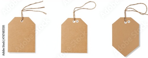 Three tags with a cork backing are hanging from a string. The tags are all different shapes and sizes