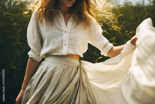
A naturalistic photo capturing the beauty of a person wearing a flowy skirt made from organic cotton, embodying sustainable and ethical fashion practices.