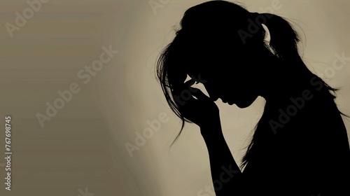 silhouette of a woman crying