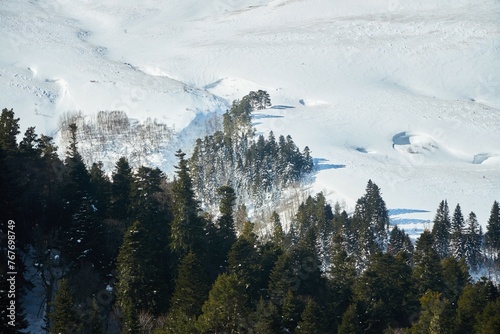 Mountain landscape in winter. The surfaces are covered with snow.