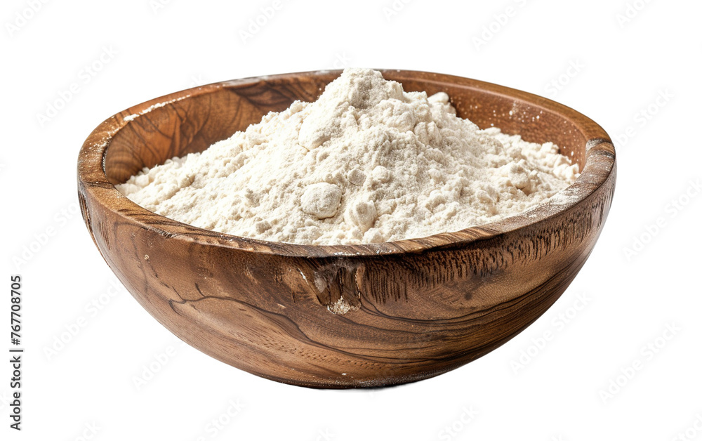 Flour in a wooden bowl isolated on white or transparent background