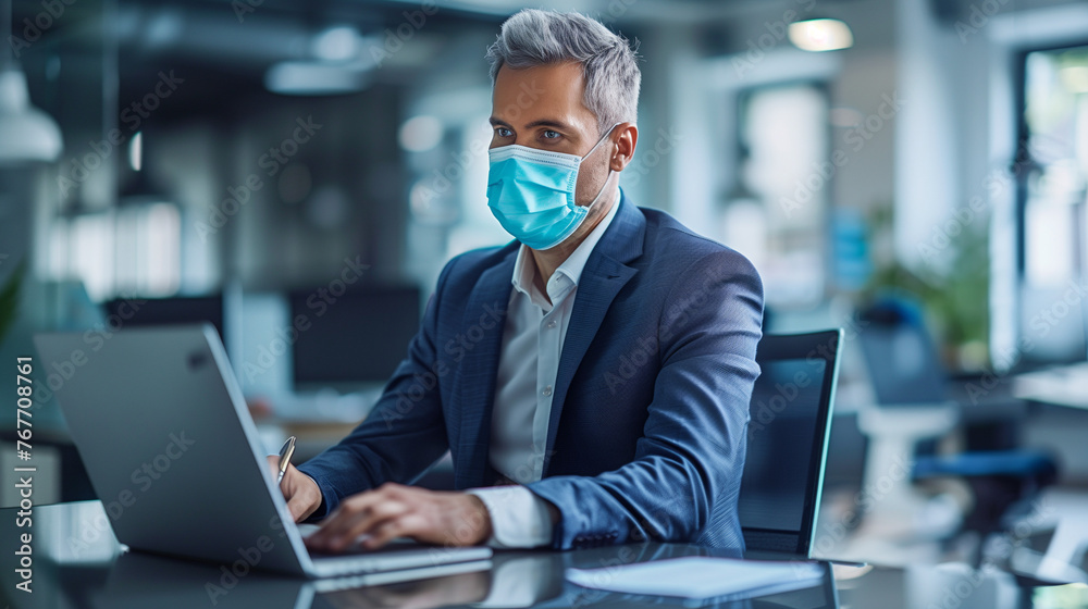 businessman wearing surgical mask and working with laptop in the office businessman wearing surgical mask and working with laptop in the office