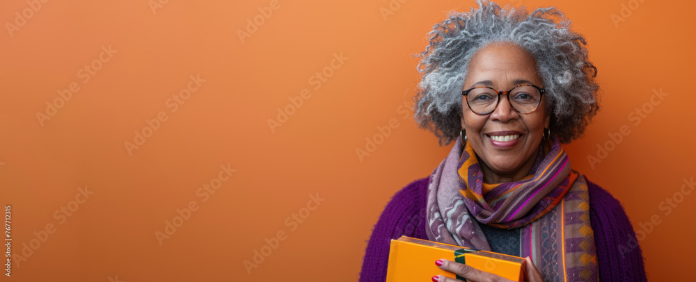 Elderly woman with gray hair and glasses holding a folder in her hands. Delivery service concept.