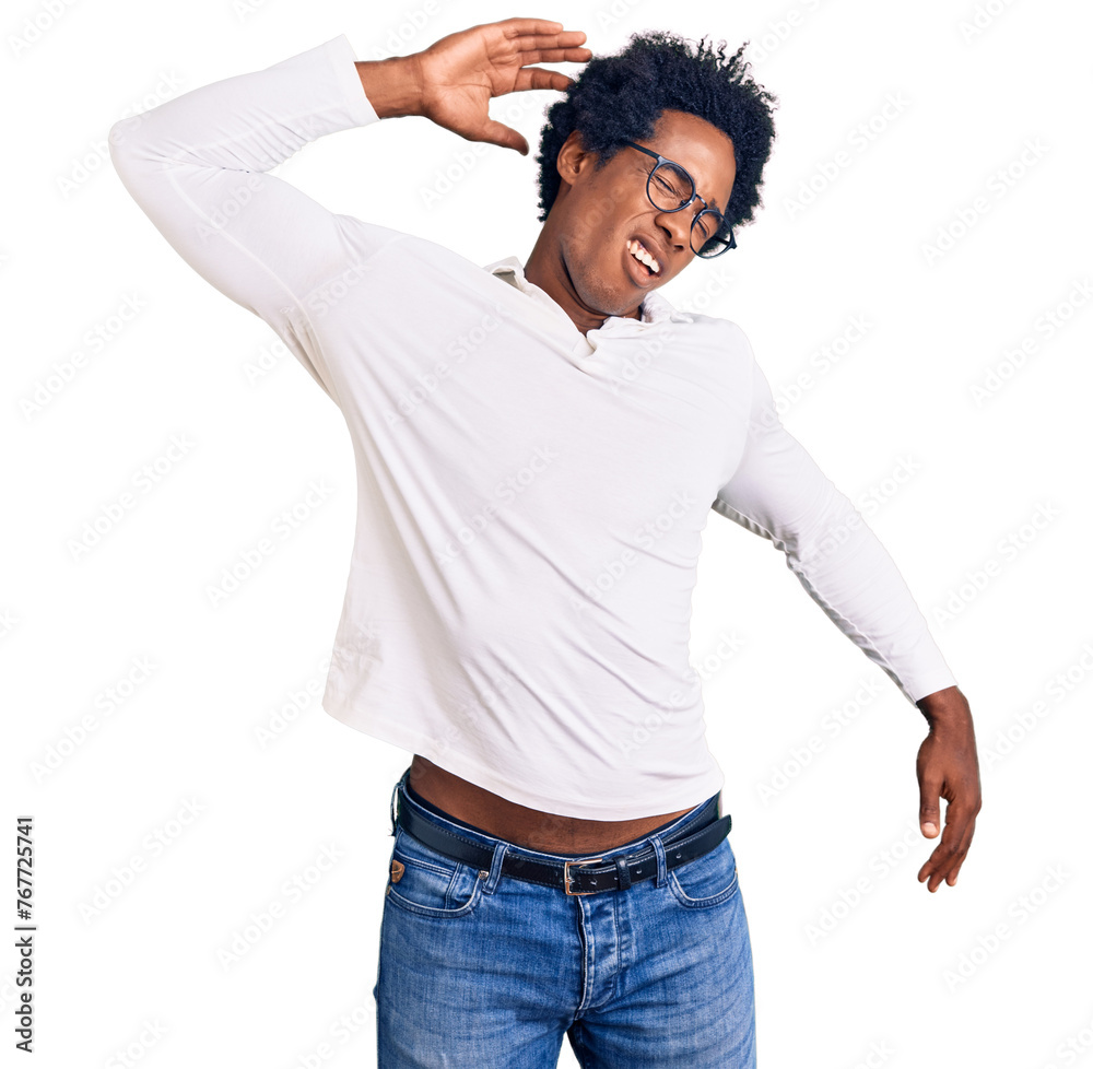 Handsome african american man with afro hair wearing casual clothes and glasses stretching back, tired and relaxed, sleepy and yawning for early morning Handsome african american man with afro hair wearing casual clothes and glasses stretching back, tired and relaxed, sleepy and yawning for early morning
