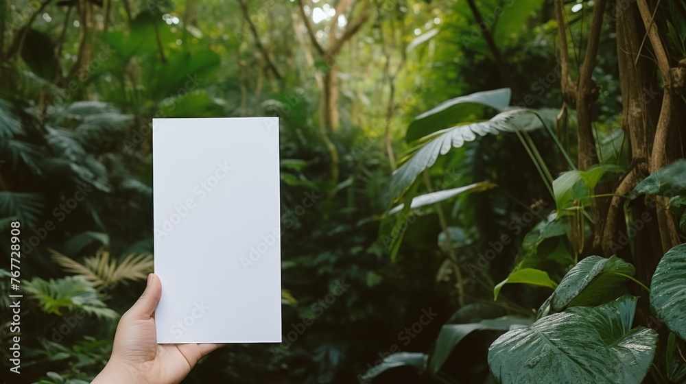 Hand Holding Blank Card in Lush Greenery Hand Holding Blank Card in Lush Greenery