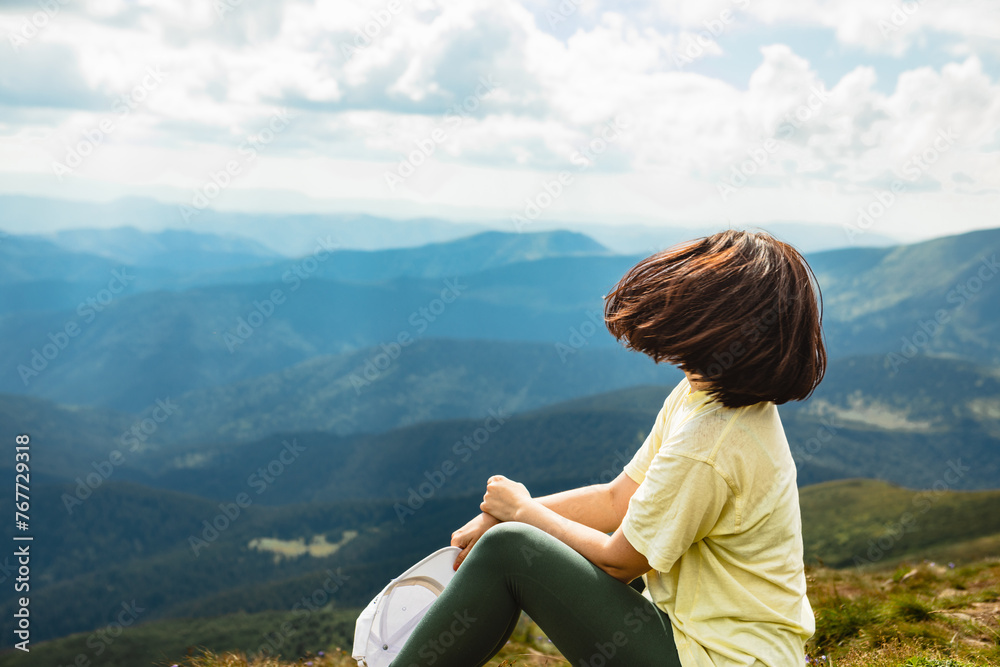 Woman on the top of a mountain Woman on the top of a mountain