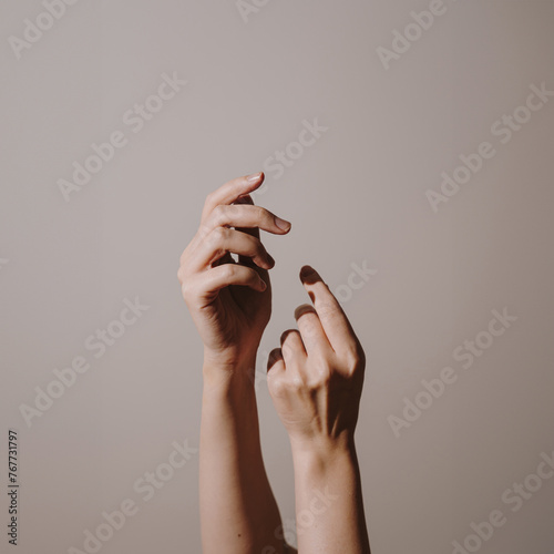 Elegant female hands over white background. Soft skin, skincare concept