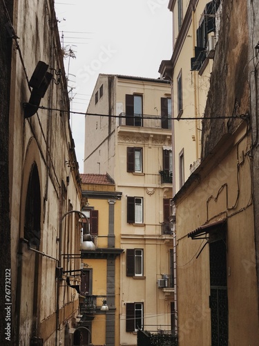 Fototapeta Naklejka Na Ścianę i Meble -  Old historic Italian architecture. Traditional European old town buildings in Naples, Italy. Vacation travel background