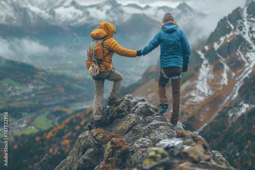 Two people are climbing a mountain together