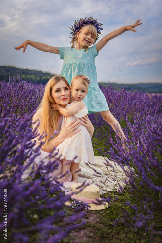 mother with two daughters on a lavender field
