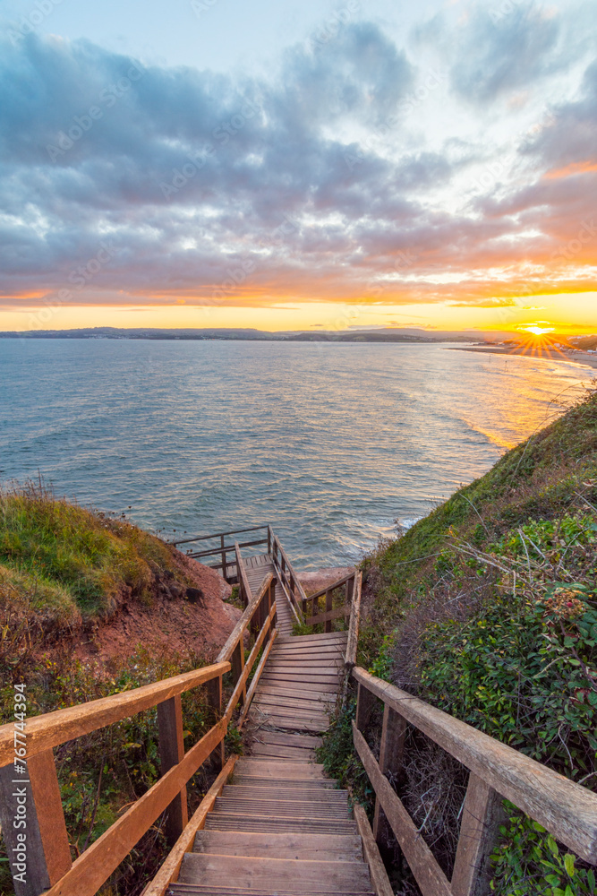 Obraz premium Stairs to Exmouth Beach from Orcombe Point at Sunset - Exmouth, Devon, UK
