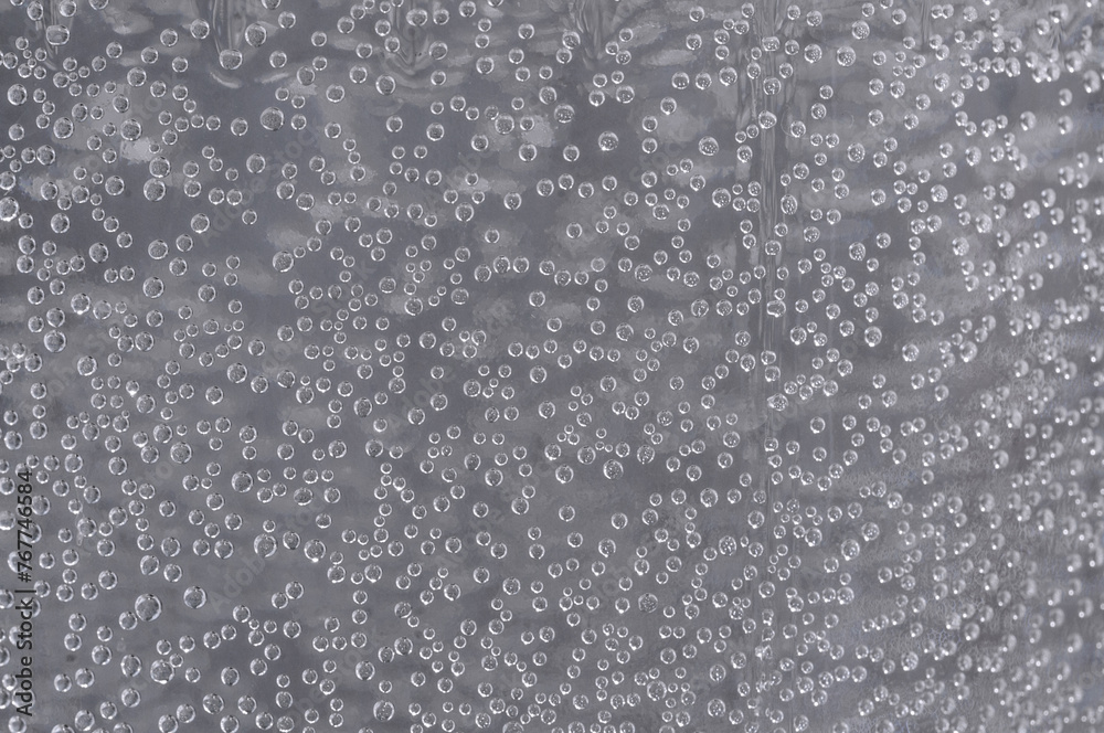 Many small bubbles in the water. Abstract gray background with air bubbles Many small bubbles in the water. Abstract gray background with air bubbles