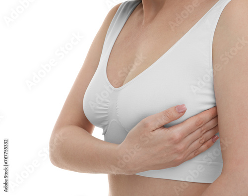 Mammology. Young woman doing breast self-examination on white background, closeup