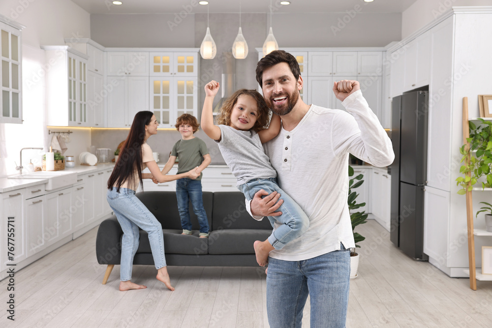 Happy family dancing and having fun at home Happy family dancing and having fun at home