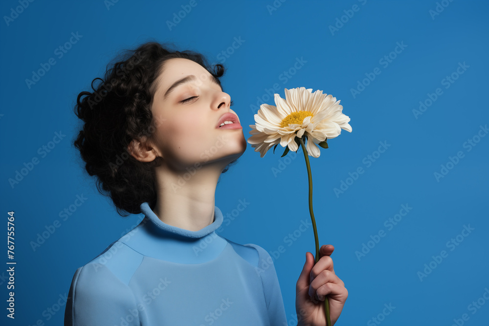 Scent of Joy: Young Woman with Eyes Closed Smelling a Daisy Scent of Joy: Young Woman with Eyes Closed Smelling a Daisy