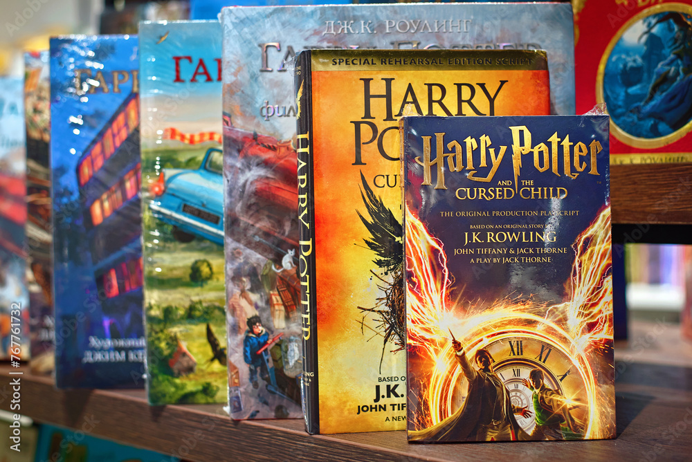 Fototapeta premium Minsk, Belarus. Mar 3, 2024. Harry Potter and the cursed child and other magical collection of Harry Potter books neatly arranged on store shelf. J. K. Rowling, Jack Thorne, and John Tiffany
