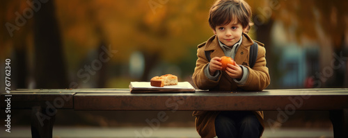 Small boy eating fresh apricot,