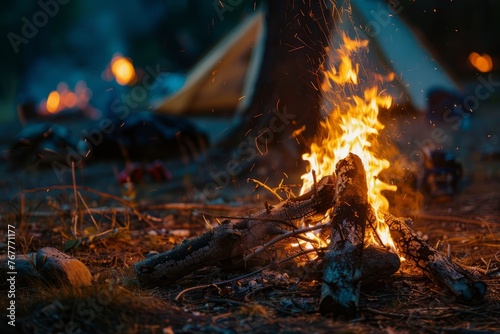 A campfire crackles in a field, with a tent visible in the background