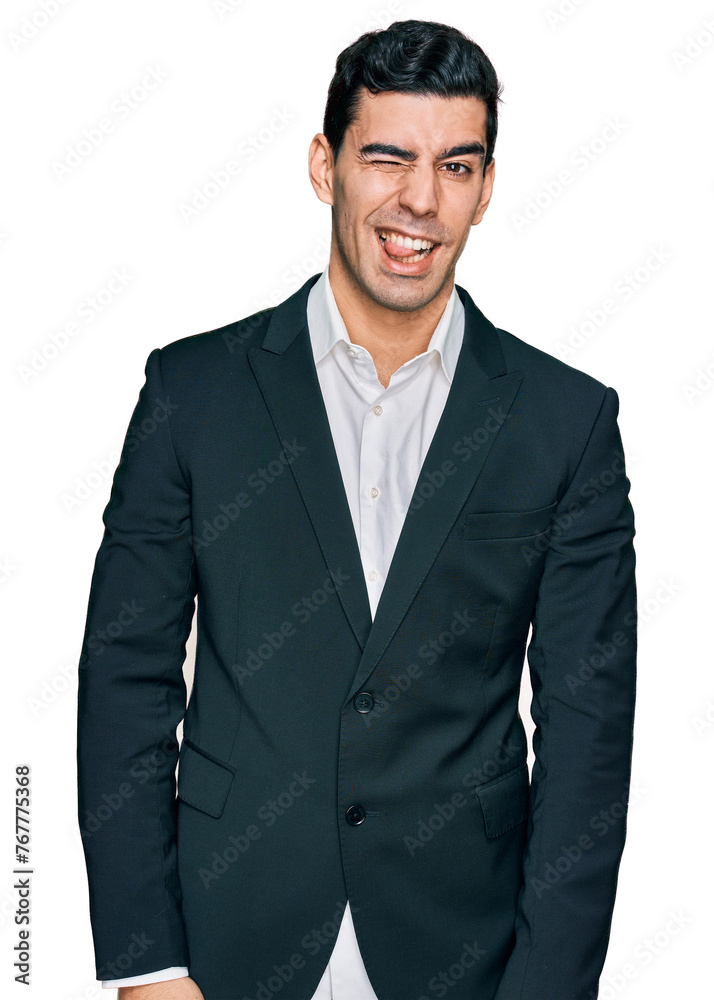 Handsome hispanic man wearing business clothes winking looking at the camera with sexy expression, cheerful and happy face. Handsome hispanic man wearing business clothes winking looking at the camera with sexy expression, cheerful and happy face.