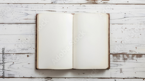 Blank sketchbook on white wooden table. Space for text, flatlay, top view