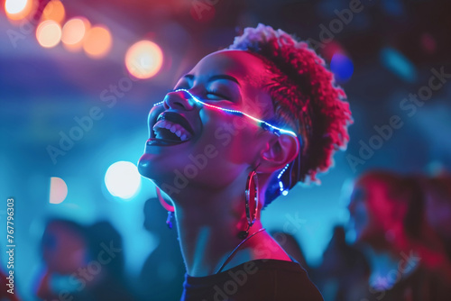 A woman wearing purple glowinthedark glasses is enjoying the entertainment of a music artist at the party. The visual effect lighting adds to the violet ambiance of the performing arts event