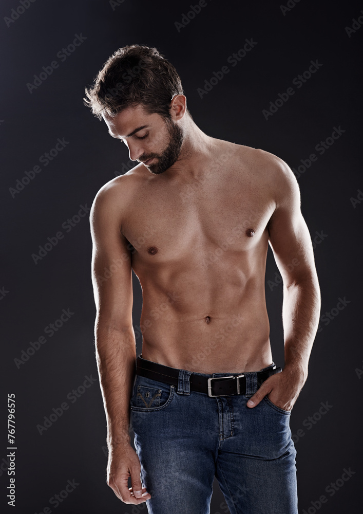 Obraz premium Thinking, abs and body of man in studio isolated on black background for wellness, fitness or eyes closed. Confidence, topless and muscle of person for health, serious or strong bodybuilder in jeans