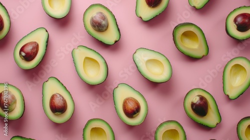 Halved Avocado on Pink Surface