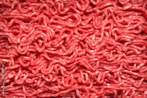 Beef minced meat texture background,  top view raw beef forcemeat  © Alex