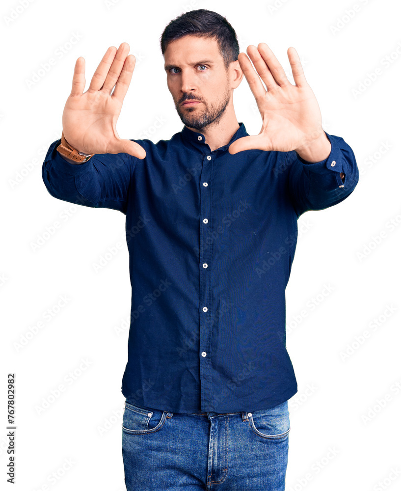 Naklejka premium Young handsome man wearing casual shirt doing frame using hands palms and fingers, camera perspective
