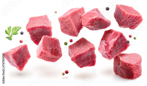 Diced beef cuts levitating in air on white background. File contains clipping paths. © volff