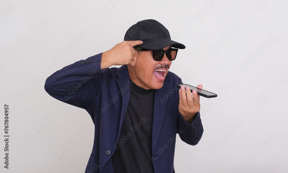 Angry man shouting out loud to someone speaking on his smartphone Angry man shouting out loud to someone speaking on his smartphone