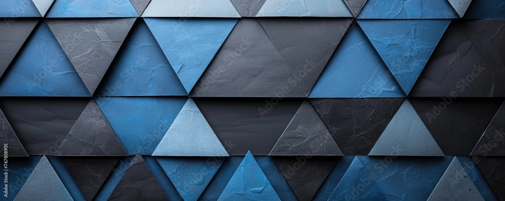 Vivid geometric shapes in black and blue create a futuristic 3D illusion with a high-tech vibe. Vivid geometric shapes in black and blue create a futuristic 3D illusion with a high-tech vibe.