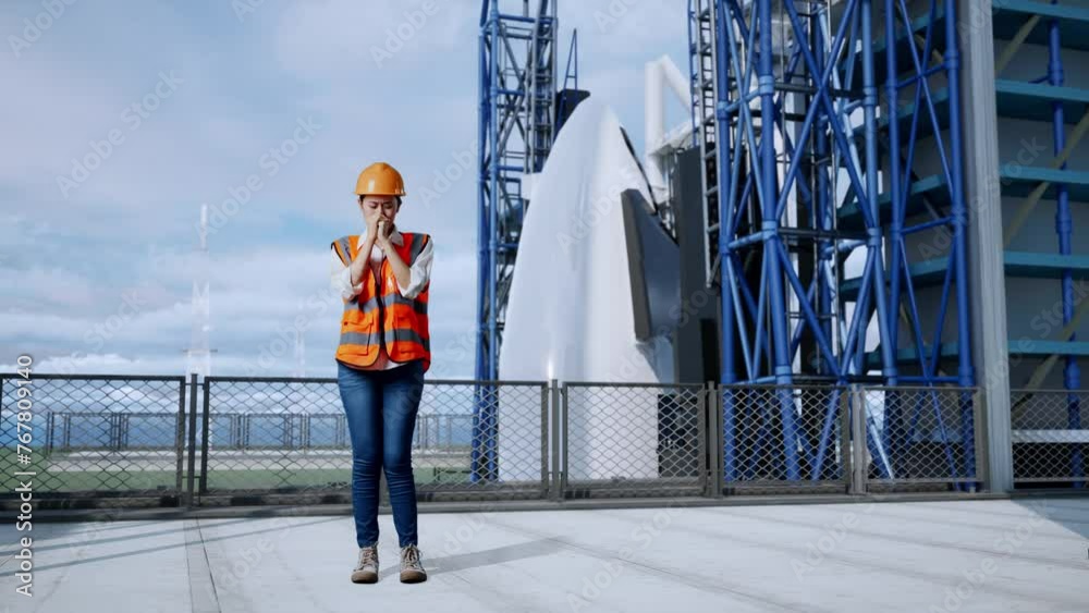 Full Body Of Asian Female Engineer With Safety Helmet Pray For Something While Standing With Space Shuttle Full Body Of Asian Female Engineer With Safety Helmet Pray For Something While Standing With Space Shuttle