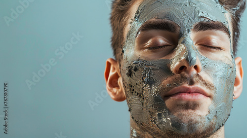 Young man with closed eyes and face mask on isolated white background