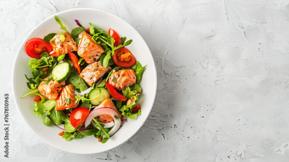 White bowl with copy space filled with salmon salad and fresh veggies, seen from above, with room for text. White bowl with copy space filled with salmon salad and fresh veggies, seen from above, with room for text.