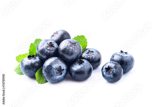 Blueberries with mint leaves on white backgrounds