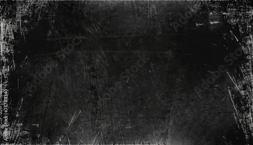 Black grunge scratched background, old film effect, dusty scary texture; template for graphic; web banner with copy space dark edges