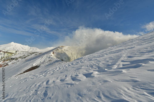 Smoke rising from winter landscape snow-capped Mt. Tokachi volcano, Hokkaido, Japan © Andreas