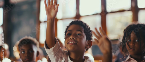 Curious child raising hand in a classroom, eager to learn and participate. photo