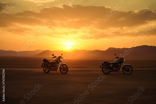 motorcycles are silhouetted against a sunset in a vast, tranquil desert,