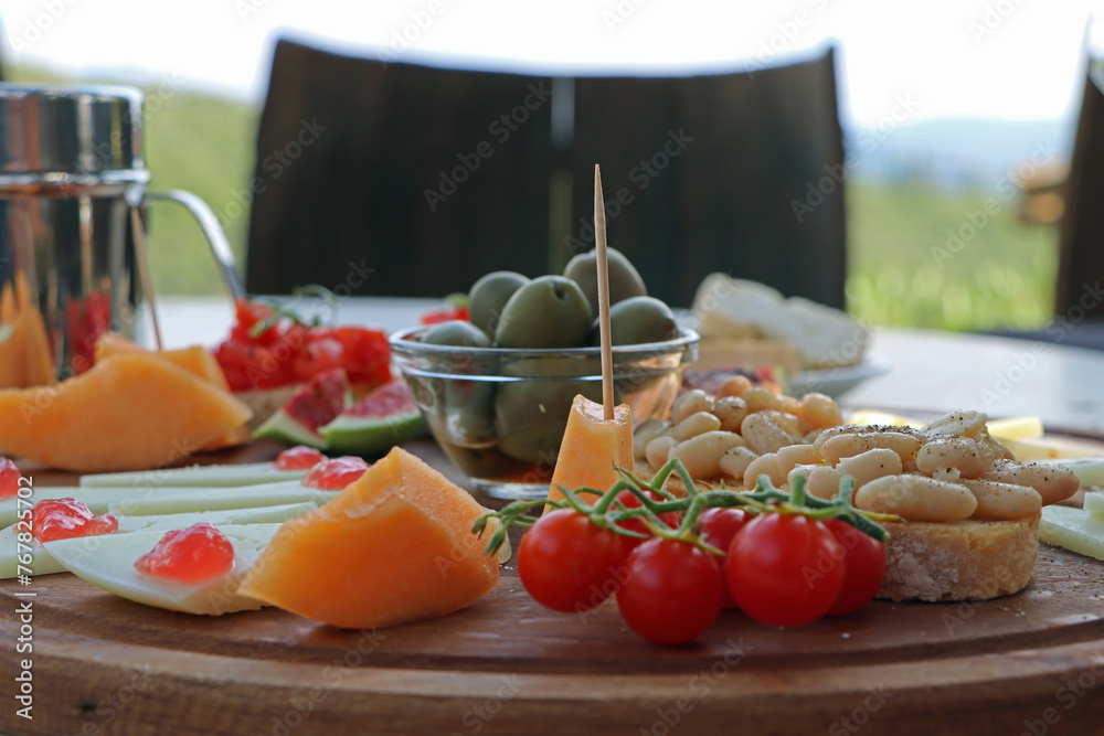 Healthy mediterranean vegeterian cheese and fruit plate 