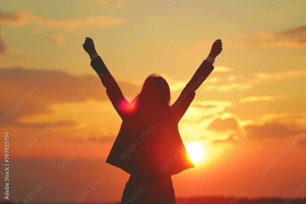 silhouette of super business woman feel excited with sunset