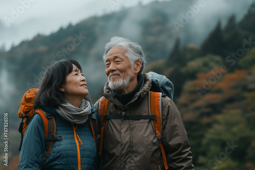 Senior Asian couple exploring a picturesque destination during their travel adventure.