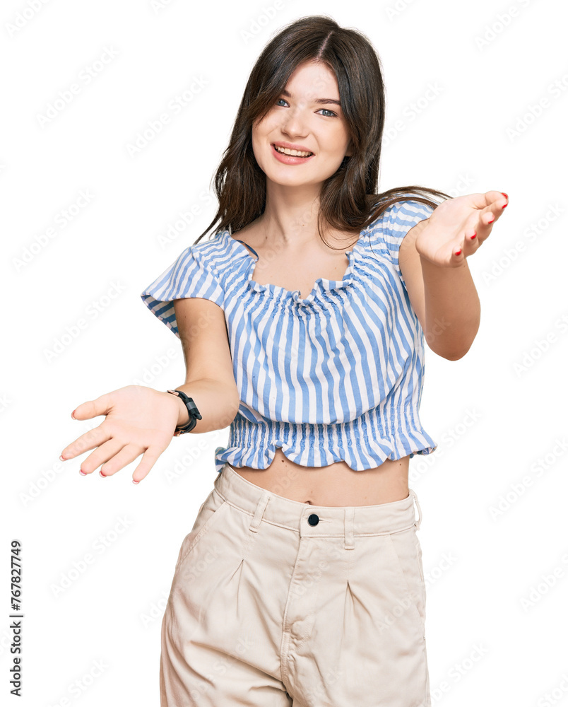Young beautiful caucasian girl wearing casual clothes smiling cheerful offering hands giving assistance and acceptance. Young beautiful caucasian girl wearing casual clothes smiling cheerful offering hands giving assistance and acceptance.