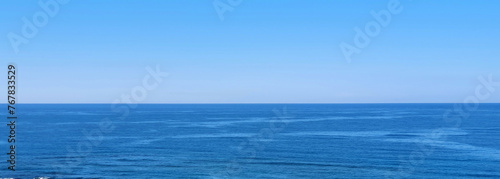 Beautiful blue sea and large calm waves .Travel Background.