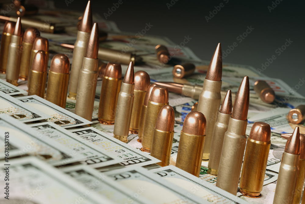 Shiny Bullets on a of US Dollar Bills The Intersection of Finance and Warfare - obrazy, fototapety, plakaty 