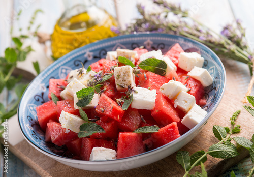 watermelon salad with feta cheese mint and lavender flowers